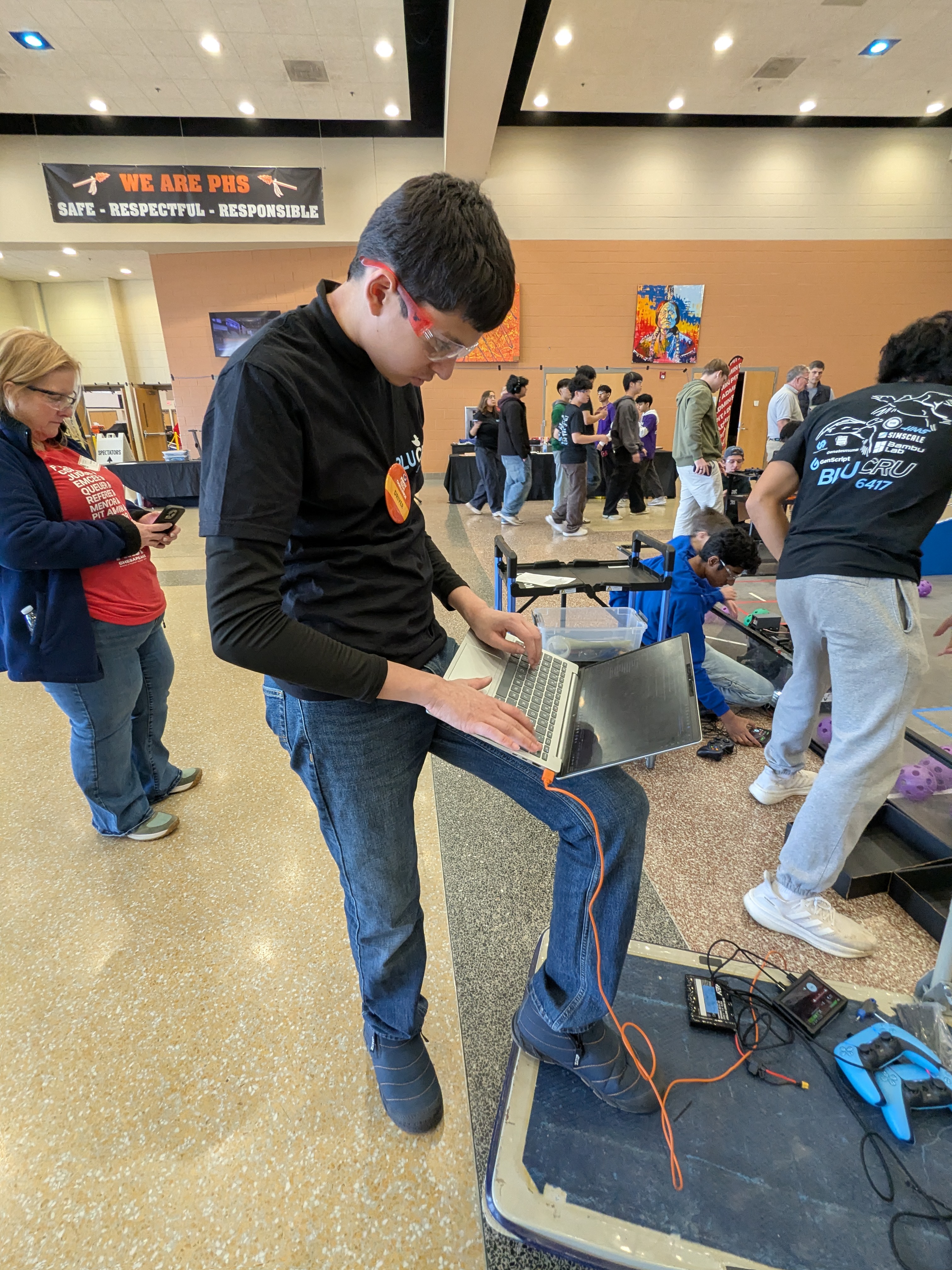 Deven coding at a competition venue